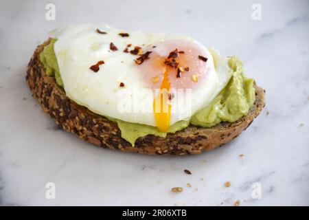 Egg on toast, avocado Toast, Keto Diet, Meal, Breakfast, Healthy, Nutritious, Fried egg on toast, open sandwich, Avocado Stock Photo