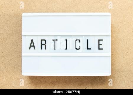 Lightbox with word article on wood background Stock Photo