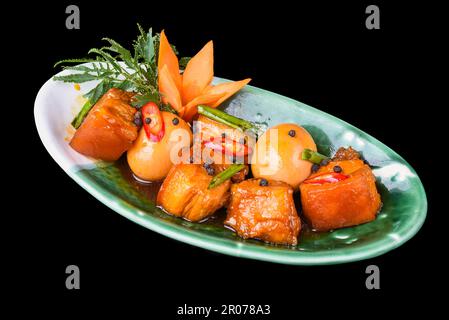 Vietnamese braised pork with boiled eggs in soy sauce for a menu Stock Photo