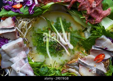 Korean hot pot with raw seafood on black background Stock Photo