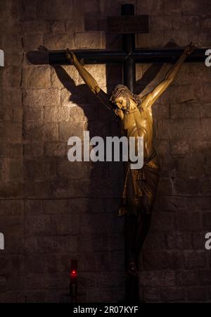 Old medieval crucifix in Italian church - made of wood Stock Photo