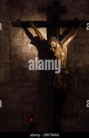 Old medieval crucifix in Italian church - made of wood Stock Photo