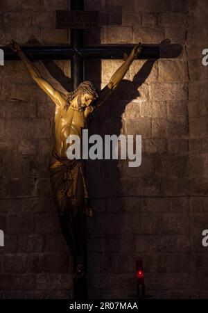 Old medieval crucifix in Italian church - made of wood Stock Photo