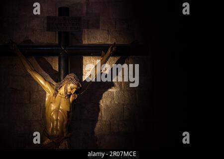 Old medieval crucifix in Italian church - made of wood Stock Photo