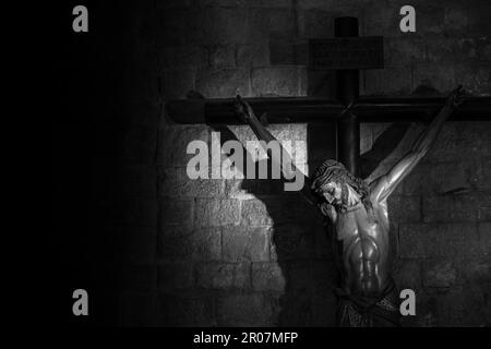 Old medieval crucifix in Italian church - made of wood Stock Photo