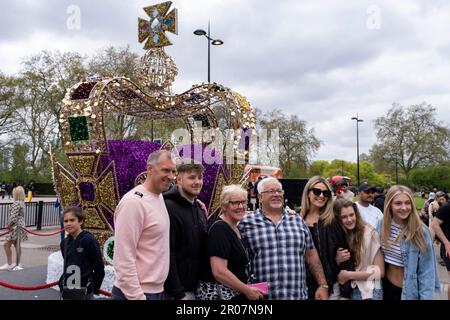 People take pictures of a giant 16’ replica of the crown which was used in the Coronation of King Charles III installed at Marble Arch on 7th May 2023 in London, United Kingdom. St Edward’s Crown was used for the first time in 70 years as the new King of England was crowned. Stock Photo