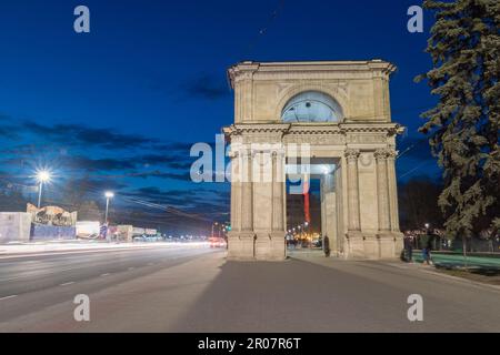 Chisinau, Moldova - March 8, 2023: Night view on Triumphal arch (Arcul de triumf) in Chisinau. Popular tourist attraction in capital of Moldova. Stock Photo