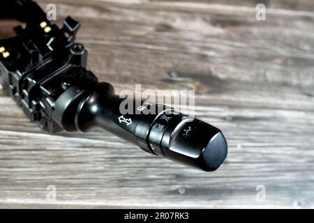 Cairo, Egypt, May 4 2023: car turn signal control system lever switch for Kia and Hyundai cars, Turn Signal Headlight Dimmer Switch used to control ca Stock Photo
