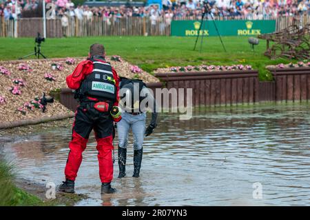 Bristol, UK. 07th May, 2023. 7th May 2023. Tom Crisp bows to the crowd after falling at the lake complex during the Cross Country Phase on Day 3 of the 2023 Badminton Horse Trials presented by MARS at Badminton House near Bristol, Gloucestershire, England, United Kingdom. Credit: Jonathan Clarke/Alamy Live News Stock Photo