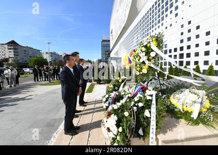 Belgrade, Serbia. 7th May, 2023. Representatives from Chinese enterprises mourn in front of the memorial monument at the site of the bombed former Chinese Embassy in the Federal Republic of Yugoslavia in Belgrade, Serbia, May 7, 2023. The Serbians and the Chinese gathered at the site of the bombed former Chinese Embassy in the Federal Republic of Yugoslavia in Belgrade on Sunday to mark the 24th anniversary of the killing of three Chinese journalists in the 1999 North Atlantic Treaty Organization (NATO) aggression on Yugoslavia. Credit: Ren Pengfei/Xinhua/Alamy Live News Stock Photo