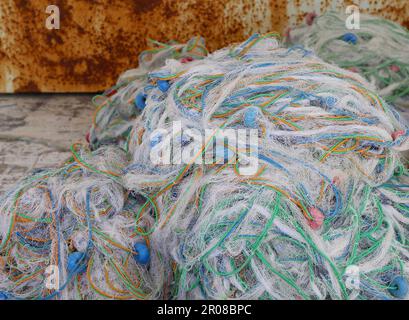 Colorful Fishing nets with Rusty Metal Background at The Karatas Port in Adana, Turkey Stock Photo