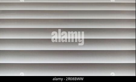 Window blinds with wavy gray striped background Stock Photo