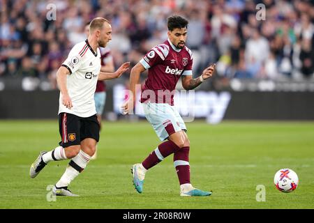 Manchester United's Christian Eriksen (left) and West Ham United's Lucas Paqueta battle for the ball during the Premier League match at the London Stadium. Picture date: Sunday May 7, 2023. Stock Photo