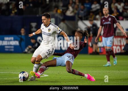 Los Angeles Galaxy midfielder Mark Delgado (8) and Colorado Rapids forward Kévin Cabral (91) fight for possession during a MLS match, Saturday, May 6, Stock Photo