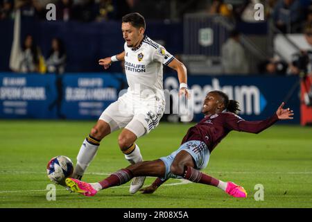 Los Angeles Galaxy midfielder Mark Delgado (8) and Colorado Rapids forward Kévin Cabral (91) fight for possession during a MLS match, Saturday, May 6, Stock Photo