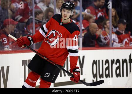 Download Jack Hughes of the New Jersey Devils in Action Wallpaper