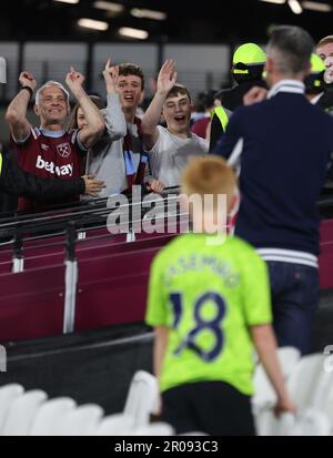 London, UK. 7th May, 2023. West Ham united fans gesture towards Manchester United fans during the Premier League match at the London Stadium, London. Picture credit should read: Paul Terry/Sportimage Credit: Sportimage Ltd/Alamy Live News Stock Photo