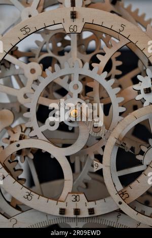 A wooden mechanical clock with exposed gears Stock Photo - Alamy