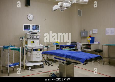 Prepped for a surgical procedure. monitoring equipment and a bed in an empty hospital ward. Stock Photo