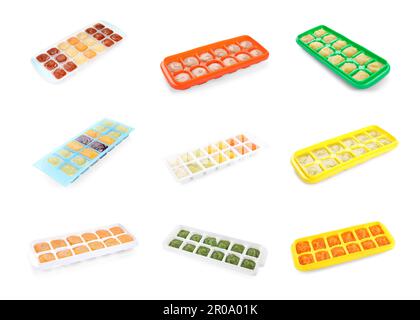 Set with frozen puree in ice cube trays on white background Stock Photo