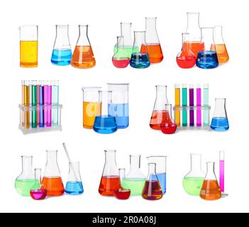Set of laboratory glassware with colorful liquids on white background ...
