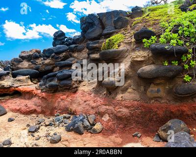 Lava Rocks Embedded in Ancient Lava Flow on Donkey Beach, Kauai, Hawaii, USA Stock Photo