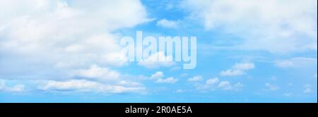 White cumulus clouds on clear blue sky background panorama, beautiful cloudscape wide panoramic view, cloudy skies backdrop, fluffy cloud texture Stock Photo