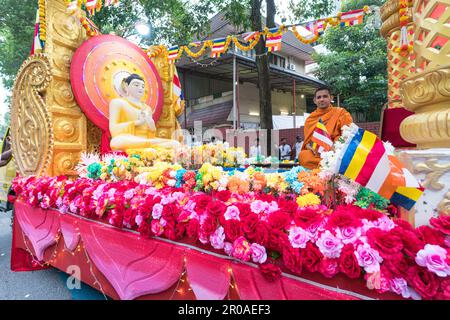 Kuala Lumpur, Malaysia, May 4th 2023: Monk sitting on a parading float, about to join the procession in celebrating Wesak Day  at the Maha Vihara Budd Stock Photo