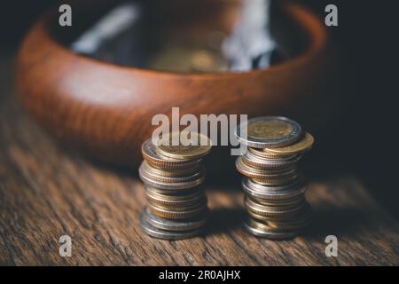 One tenth or tithe is basis on which Bible teaches us to give one tenth of first fruit to God. coins with Holy Bible. Biblical concept of Christian of Stock Photo