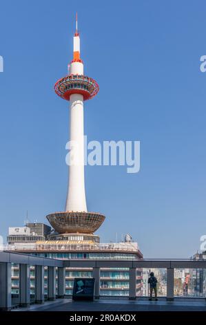 Kyoto, Japan - March 28, 2023: Kyoto Tower viewed from Kyoto Central Station in Kyoto, Japan Stock Photo