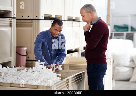 Inspecting product quality. two factory managers doing an inspection of raw materials. Stock Photo