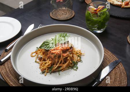 Portion of homemade spaghetti bolognese served in ceramic plate. Stock Photo