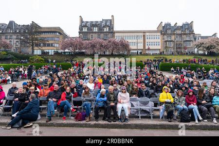 Edinburgh, Scotland, UK. 6 May 2023. Scenes from Edinburgh on the day of Coronation of King Charles III. Members of the public in West Princes Street Stock Photo