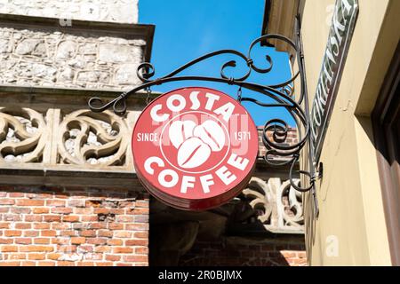 Costa Coffee logo sign. British coffeehouse chain company emblem signboard on display on a branch building wall. Stock Photo