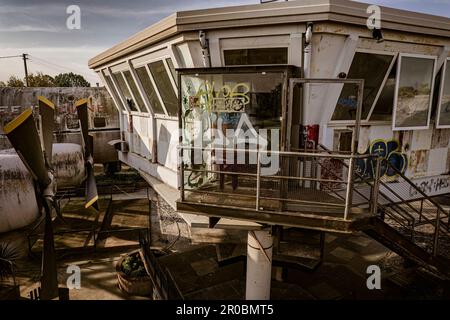 A haunting shot of an abandoned and vandalized airport control tower, left to decay and ruin. Stock Photo