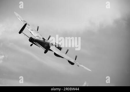 Monochrome black and white Avro Lancaster PA474 of the Royal Air Force, RAF, Battle of Britain Memorial Flight at low level over RAF Cranwell, 7 May 2 Stock Photo