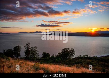 Sunset over Ardmucknish Bay and a distant Isle of Mull from Ben Lora, Benderloch, Argyll Stock Photo