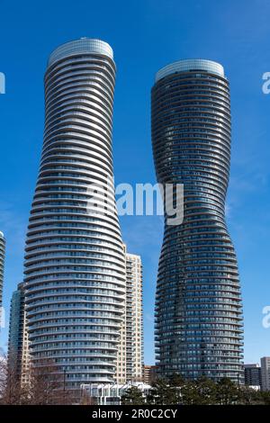 Mississauga, ON, Canada-February 2023; Low angle view of Absolute World residential condominium twin tower skyscraper complex Stock Photo