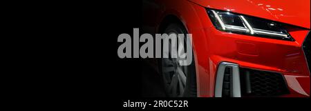Red modern car headlights on black background,copy space Stock Photo