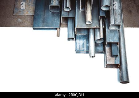 Metal profiles of different shapes and sizes on a white background Stock Photo