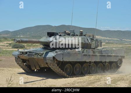 Capo Teulada, Italy. 05 May, 2023. German Army Leopard 2A7V main battle tanks with the Panzerbataillon 393 armor battalion conduct tactical maneuvers during NATO Exercise Nobel Jump 2023 at the Capo Teulada Training Area, May 5, 2023 in Capo Teulada, Sardinia, Italy.  Credit: MSgt Carl Schulze/NATO Command Naples/Alamy Live News Stock Photo