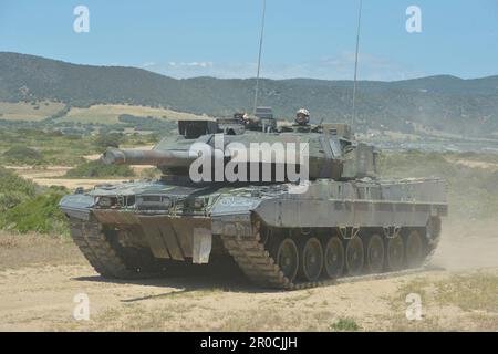 Capo Teulada, Italy. 05 May, 2023. German Army Leopard 2A7V main battle tanks with the Panzerbataillon 393 armor battalion conduct tactical maneuvers during NATO Exercise Nobel Jump 2023 at the Capo Teulada Training Area, May 5, 2023 in Capo Teulada, Sardinia, Italy.  Credit: MSgt Carl Schulze/NATO Command Naples/Alamy Live News Stock Photo