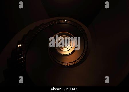 Spiral staircase in a tall multi-floor house, in the form of a 'golden ratio', architecture, concert Stock Photo