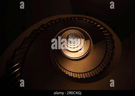 Spiral staircase in a tall multi-floor house, in the form of a 'golden ratio', architecture, concert Stock Photo