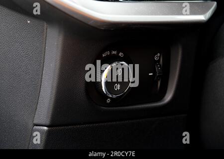 Close up headlamp switch button inside car. Selective focus. Stock Photo