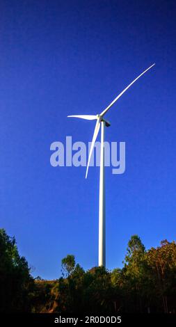 A wind turbine is a wind turbine that takes the kinetic energy from the movement of the wind and converts it into mechanical energy. Then use mechanic Stock Photo