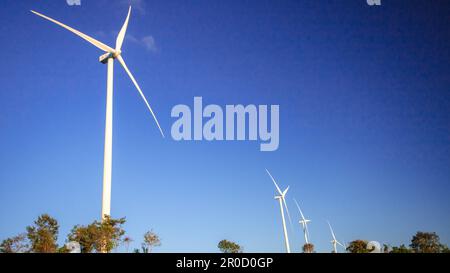 A wind turbine is a wind turbine that takes the kinetic energy from the movement of the wind and converts it into mechanical energy. Then use mechanic Stock Photo