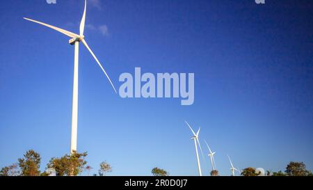 A wind turbine is a wind turbine that takes the kinetic energy from the movement of the wind and converts it into mechanical energy. Then use mechanic Stock Photo