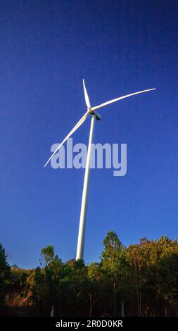 A wind turbine is a wind turbine that takes the kinetic energy from the movement of the wind and converts it into mechanical energy. Then use mechanic Stock Photo