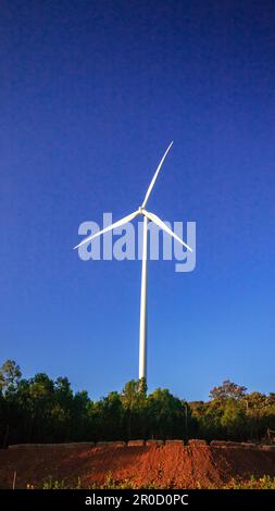 A wind turbine is a wind turbine that takes the kinetic energy from the movement of the wind and converts it into mechanical energy. Then use mechanic Stock Photo